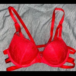 Vs string lace bra , latches in front.